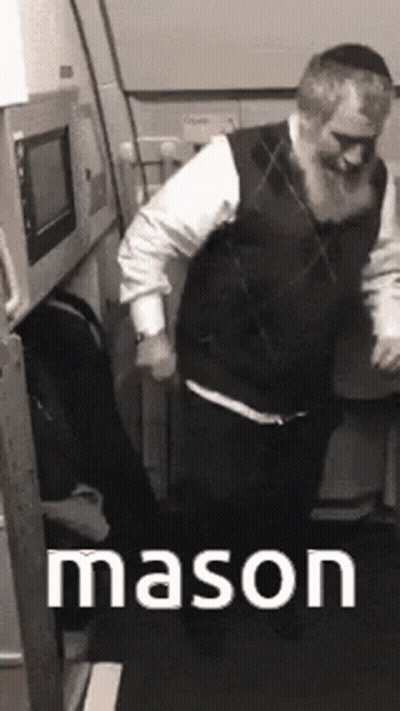 A Man With A Beard Is Dancing In A Room With The Word Mason Written On The Bottom GIF