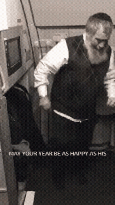 A Man With A Beard Is Dancing In A Room With The Words May Your Year Be As Happy As His On The Bottom GIF