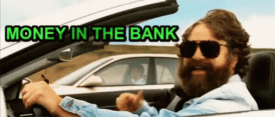 A Man With A Beard Is Driving A Car With The Words Money In The Bank Below Him GIF