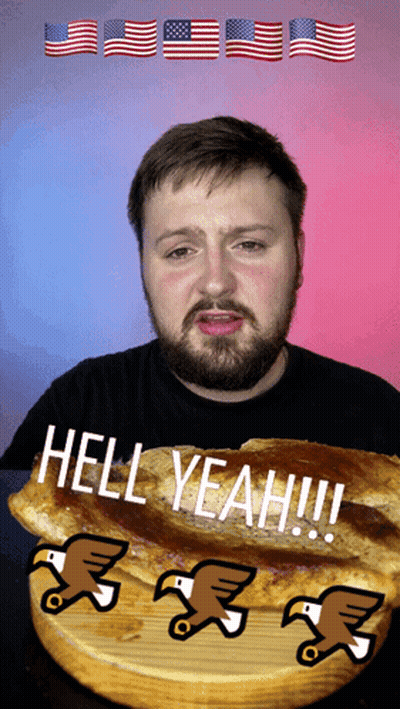 A Man With A Beard Is Eating A Sandwich With The Words Hell Yeah On It GIF