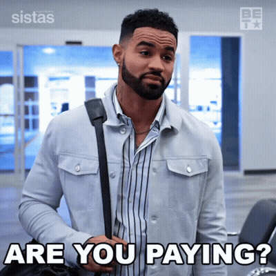 A Man With A Beard Is Holding A Bag And Says Are You Paying GIF