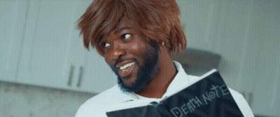 A Man With A Beard Is Holding A Book Called Death Note GIF