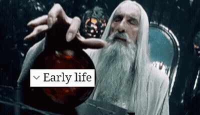 A Man With A Beard Is Holding A Bottle With The Words Early Life On It GIF