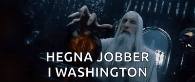 A Man With A Beard Is Holding A Bottle With The Words " Hegna Jobber I Washington " Above Him GIF