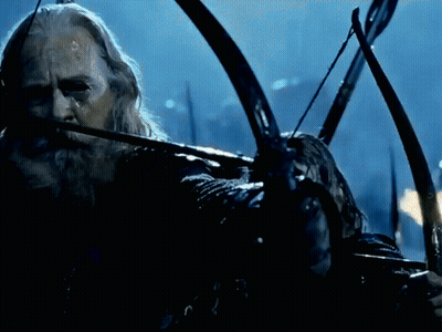 A Man With A Beard Is Holding A Bow And Arrow And The Word Twang Is Visible GIF