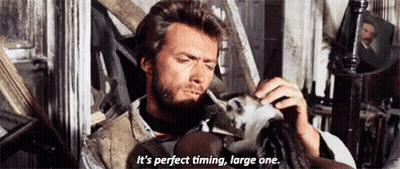 A Man With A Beard Is Holding A Doll And Says It 'S Perfect Timing Large One . GIF