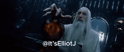A Man With A Beard Is Holding A Glowing Object And Says It 'S Elliotj GIF