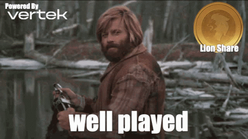 A Man With A Beard Is Holding A Gun And The Words Well Played Are On The Screen GIF