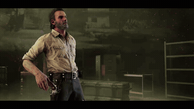 A Man With A Beard Is Holding A Gun In His Right Hand GIF