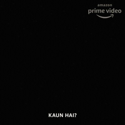 A Man With A Beard Is Holding A Lit Candle In His Hand And Says Kaun Hai GIF