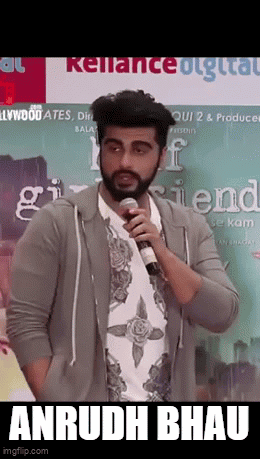 A Man With A Beard Is Holding A Microphone And Says " Anrudh Bhau " GIF