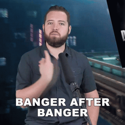 A Man With A Beard Is Holding A Microphone And Says Banger After Banger GIF