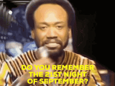 A Man With A Beard Is Holding A Microphone And Says Do You Remember The 21St Night Of September . GIF