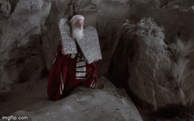 A Man With A Beard Is Holding A Plaque With The Words Has Given Unto You Written On It GIF