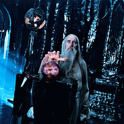 A Man With A Beard Is Holding A Purple Sphere In His Hand GIF