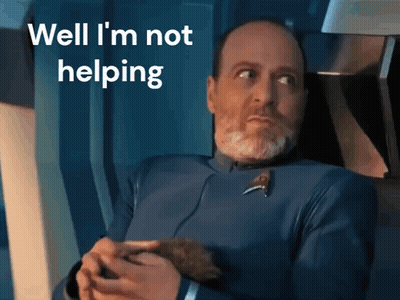 A Man With A Beard Is Holding A Small Animal And The Words Well I 'M Not Helping Are Above Him GIF