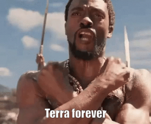 A Man With A Beard Is Holding A Spear In His Hand And Says `` Terra Forever '' . GIF
