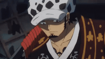 A Man With A Beard Is Holding A Sword And Wearing A Hat . GIF
