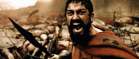 Bearded Man Holding Sword Yelling In Battle GIF