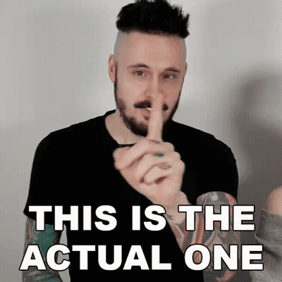 A Man With A Beard Is Holding His Finger To His Mouth And Says This Is The Actual One GIF