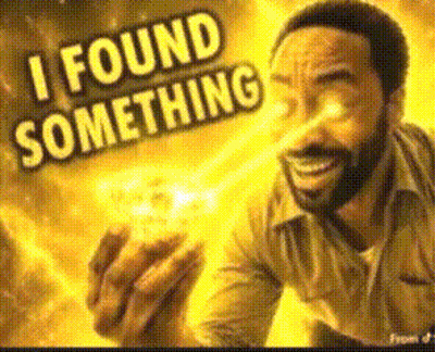 A Man With A Beard Is Holding Something In His Hand And Says I Found Something GIF