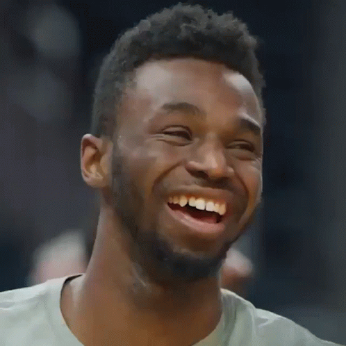 A Man With A Beard Is Laughing With His Mouth Wide Open GIF