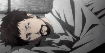 A Man With A Beard Is Laying On A Bed With His Eyes Closed GIF