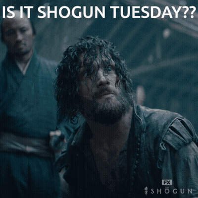 A Man With A Beard Is Laying On The Ground With The Caption " Is It Shogun Tuesday " Above Him GIF