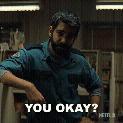 A Man With A Beard Is Leaning Against A Counter And Says You Okay GIF