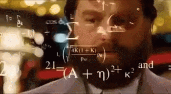 A Man With A Beard Is Looking At A Computer Screen With Mathematical Equations Coming Out Of It . GIF