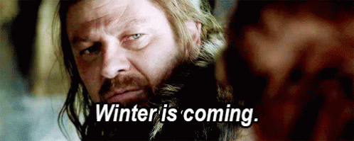A Man With A Beard Is Looking At Another Man And Saying `` Winter Is Coming . '' GIF