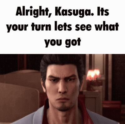A Man With A Beard Is Looking At The Camera With The Words Alright Kasuga Its Your Turn Lets See What You Got GIF