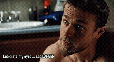 A Man With A Beard Is Looking Into His Eyes With The Words Look Into My Eyes See Danger Above Him GIF