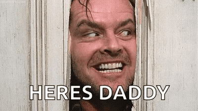 A Man With A Beard Is Looking Through A Hole In A Door And Saying `` Here 'S Daddy '' . GIF