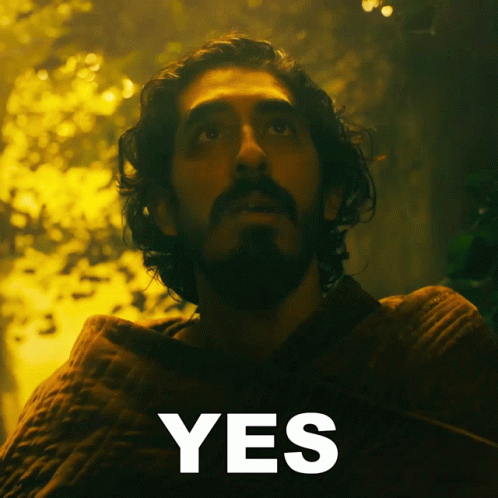 A Man With A Beard Is Looking Up And The Word Yes Is Below Him GIF