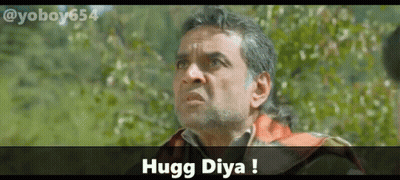 A Man With A Beard Is Looking Up With The Words Hugg Diya Above Him GIF