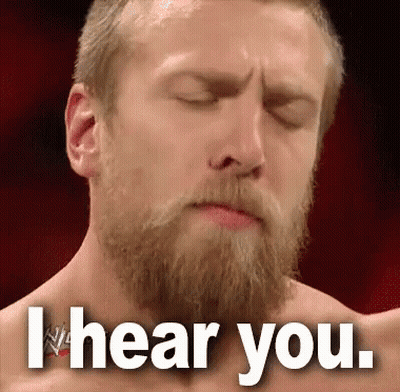 A Man With A Beard Is Making A Face With His Eyes Closed And The Words I Hear You . GIF