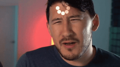 A Man With A Beard Is Making A Funny Face And Has A Circle On His Forehead . GIF