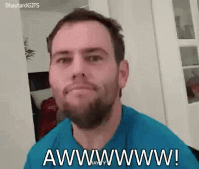 A Man With A Beard Is Making A Funny Face And Saying Awwwwww ! GIF