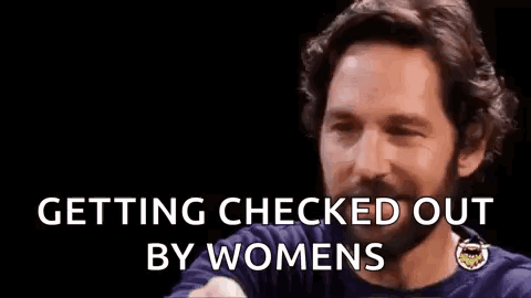 A Man With A Beard Is Making A Funny Face And Saying `` Getting Checked Out By Women '' . GIF