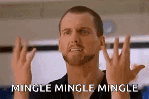 A Man With A Beard Is Making A Funny Face And Saying Mingle Mingle Mingle With His Hands . GIF