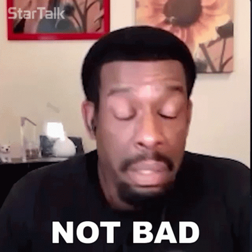 A Man With A Beard Is Making A Funny Face And Saying `` Not Bad '' . GIF