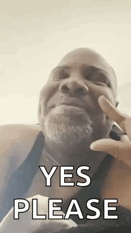 A Man With A Beard Is Making A Funny Face And Saying `` Yes Please '' . GIF