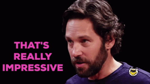A Man With A Beard Is Making A Funny Face And The Words `` That 'S Really Impressive '' Are Above Him . GIF