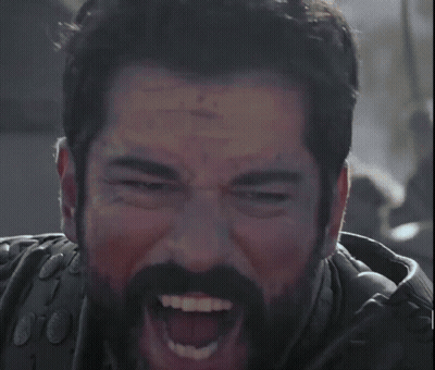 A Man With A Beard Is Making A Funny Face GIF