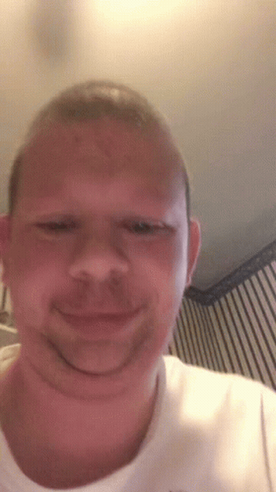 A Man With A Beard Is Making A Funny Face . GIF