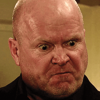 A Man With A Beard Is Making A Funny Face GIF