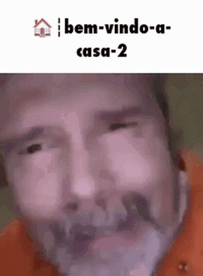 A Man With A Beard Is Making A Funny Face With The Words Bem-Vindo-A-Casa-2 Below Him GIF