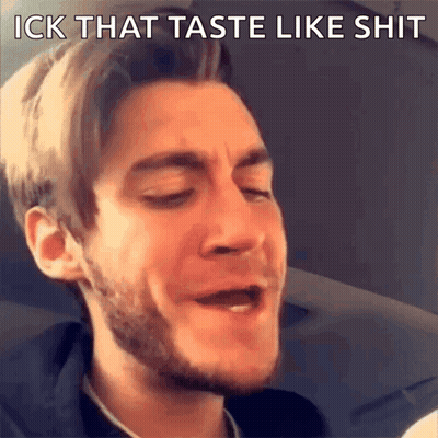 A Man With A Beard Is Making A Funny Face With The Words " Ick That Taste Like Shit " Above Him GIF