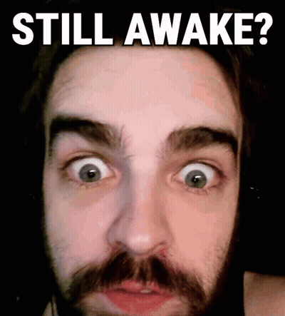 A Man With A Beard Is Making A Funny Face With The Words Still Awake Below Him GIF